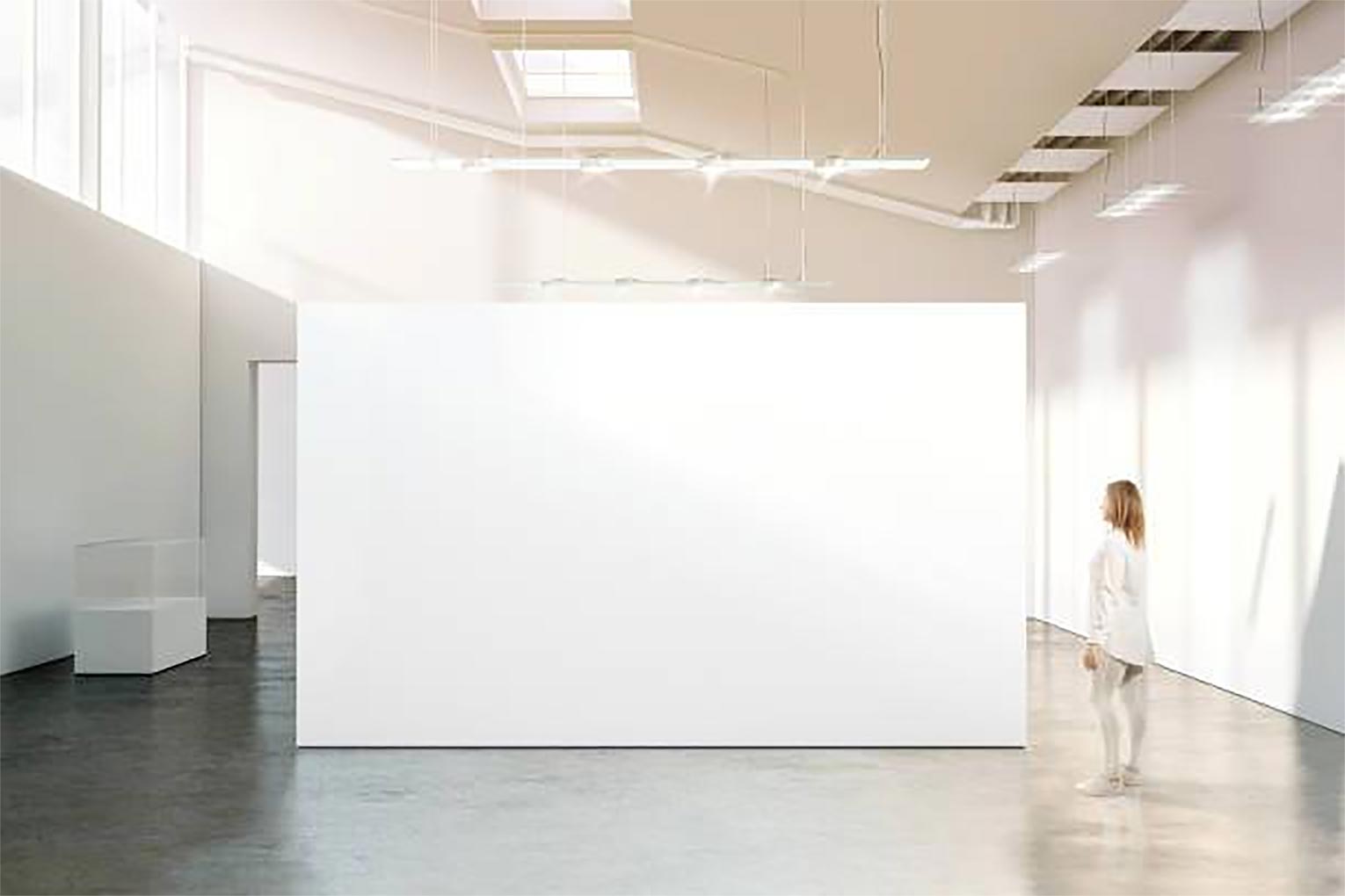 Woman walking near blank white wall mockup in modern gallery